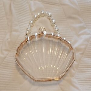 Elegant Pearl Handle Clear Shell Clutch